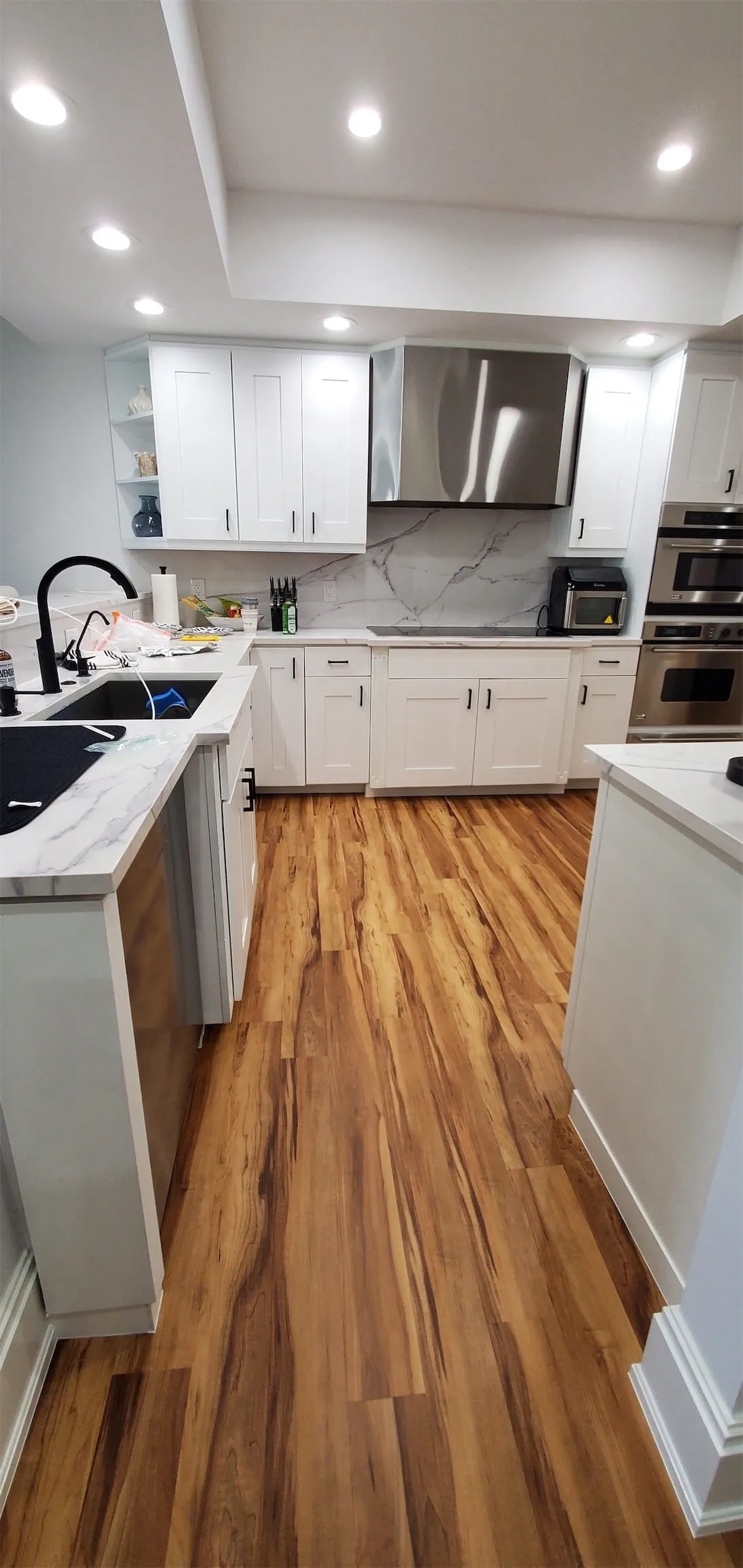 Wood-appearing floors and white cabinets