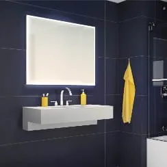 Fleurco white lit mirror in bathroom scene available at ProSource Wholesale